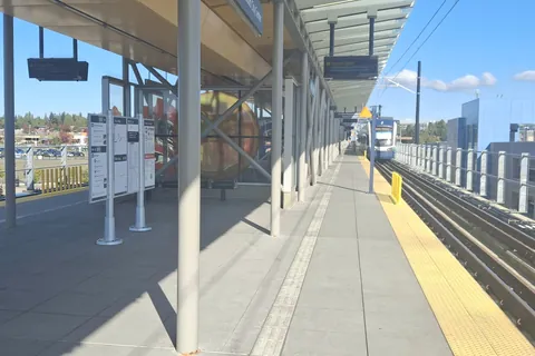 Lynnwood City Center station: an elevated light-rail platform under a long canopy.